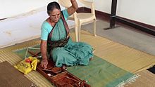 File:Lady yarn in a Charkha in Bangalore.webm